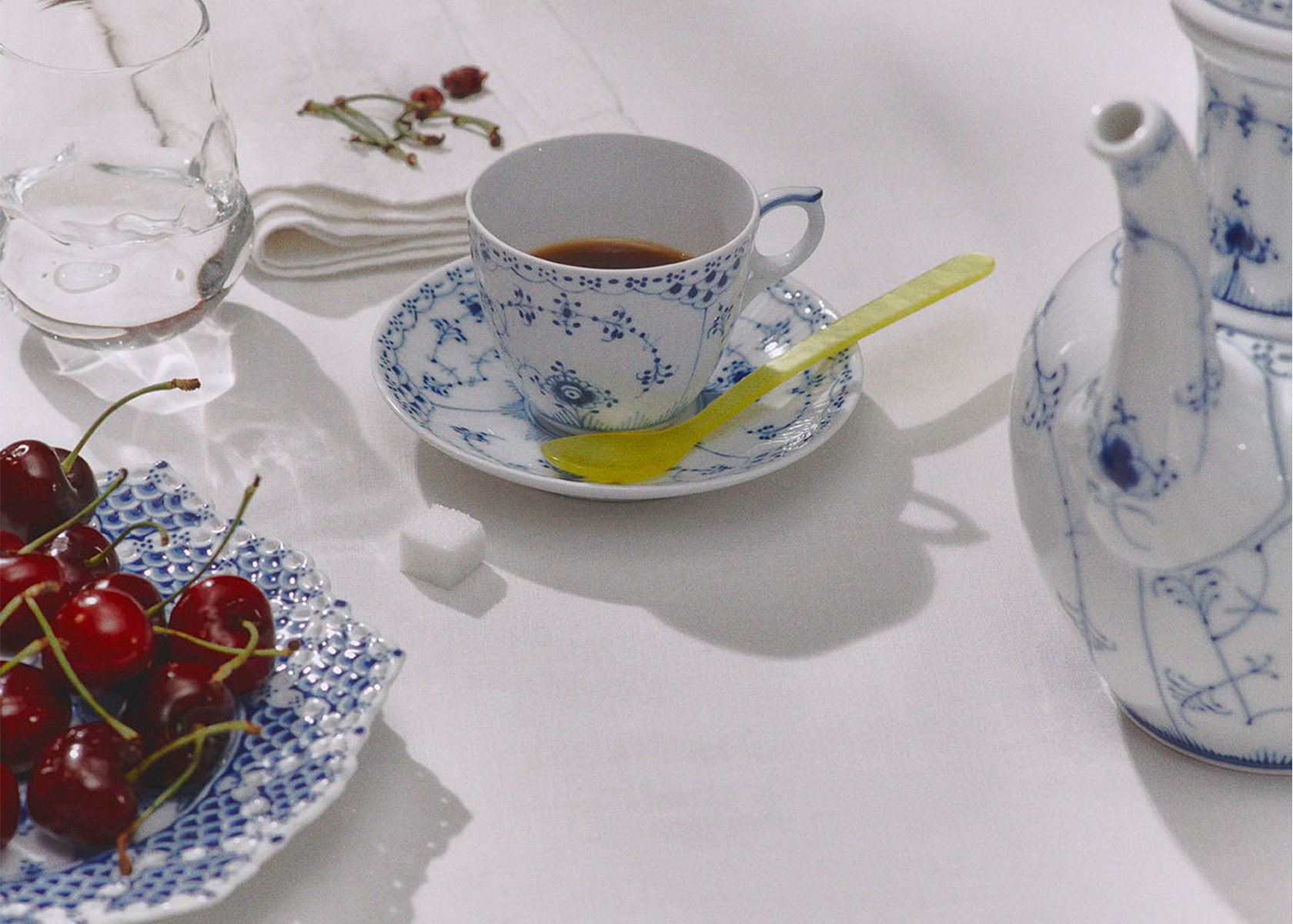 An elegant table set with Blue Fluted Half Lace and Blue Fluted Full Lace